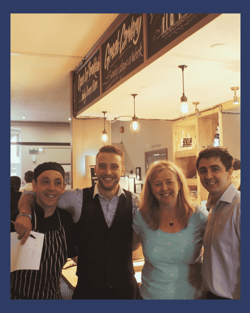 Liz, her son and two members of the team at one of her pubs.