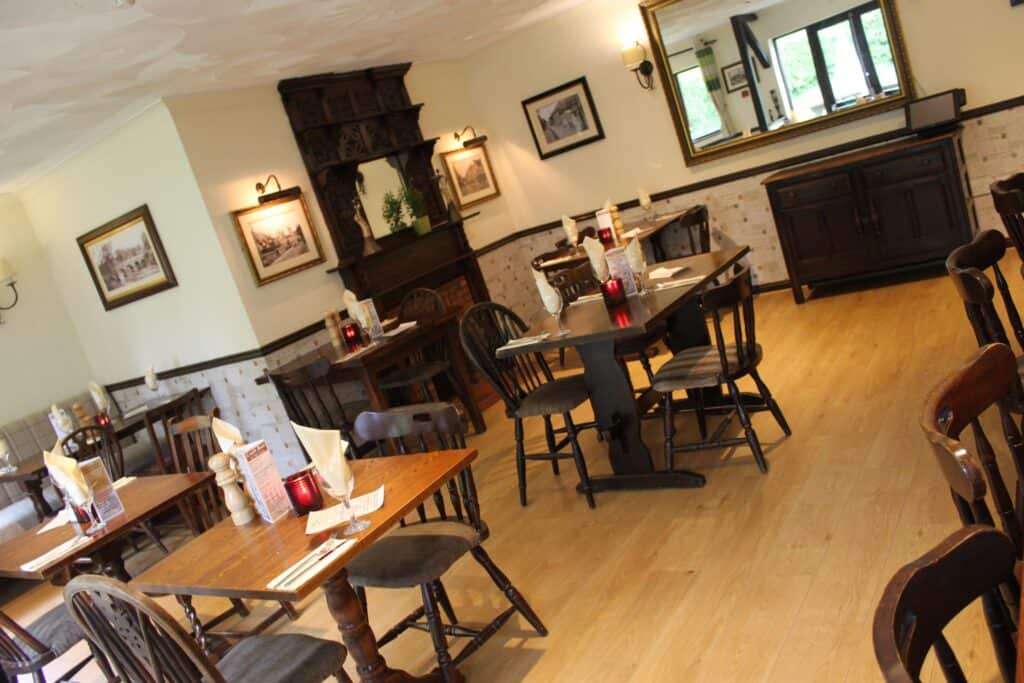 A picture of restaurant tables laid for dinner