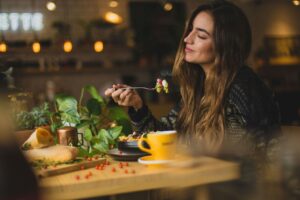 A woman enjoying her food.