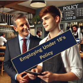 A bar manager talking to a young employee dressed to work in a bar.